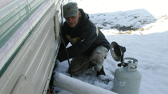 Weasel tries to thaw the pipes to our black water tank on our RV.